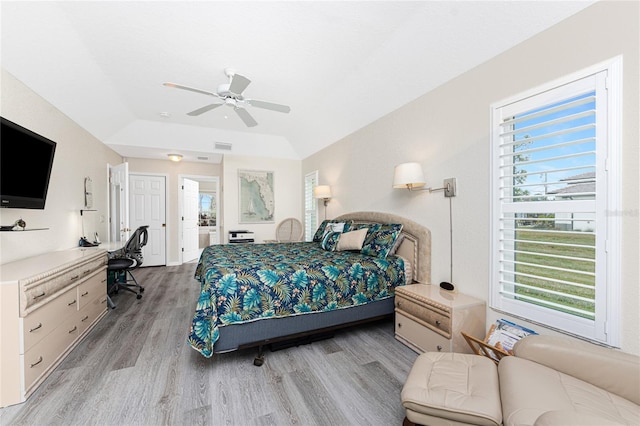 bedroom featuring lofted ceiling, ceiling fan, and light hardwood / wood-style floors