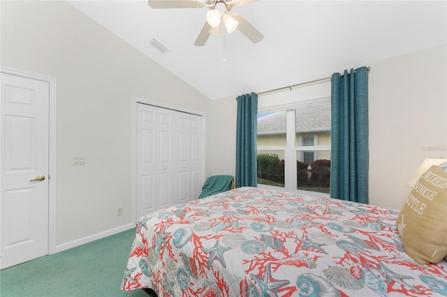 carpeted bedroom with lofted ceiling, a closet, and ceiling fan