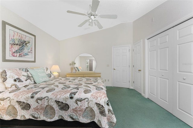 carpeted bedroom with ceiling fan, lofted ceiling, and a closet