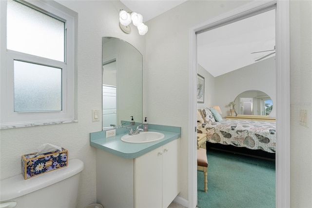 bathroom featuring ceiling fan, vanity, and toilet