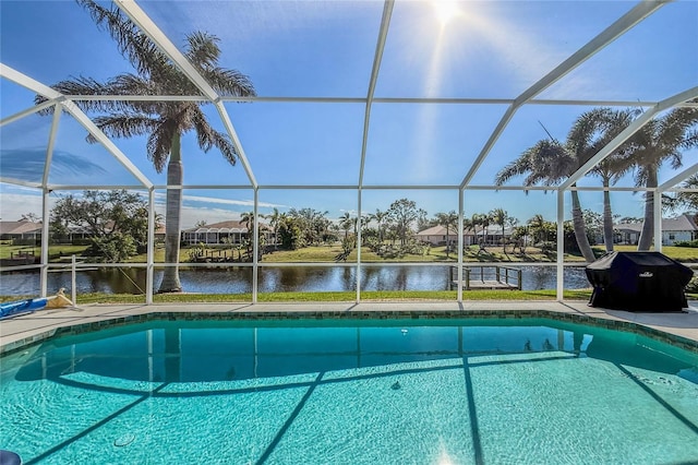 view of pool with a water view and a lanai