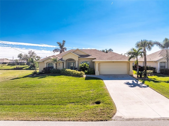 single story home with a garage and a front lawn