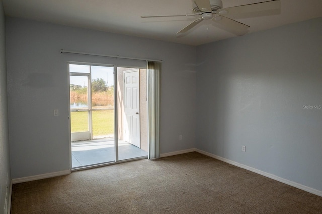 spare room with carpet and ceiling fan