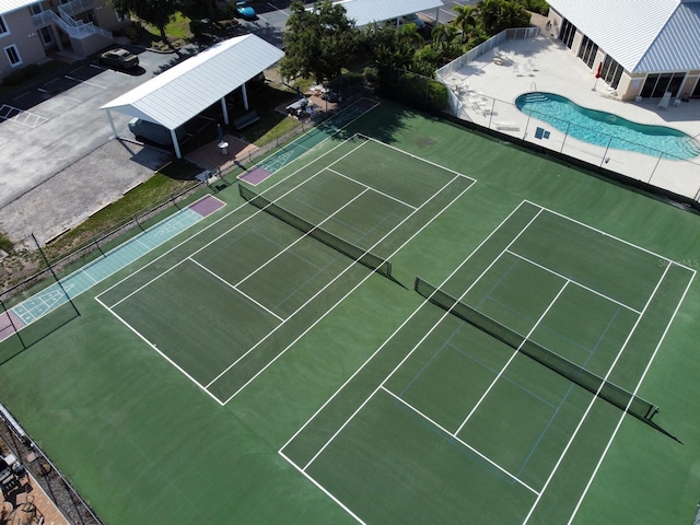 view of sport court featuring a community pool