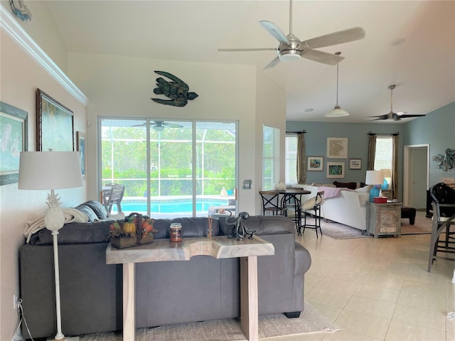 living room featuring light tile patterned floors and ceiling fan