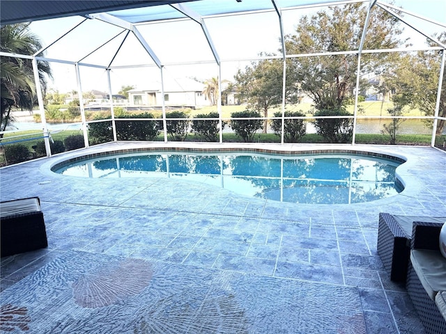 view of swimming pool featuring a lanai and a patio area