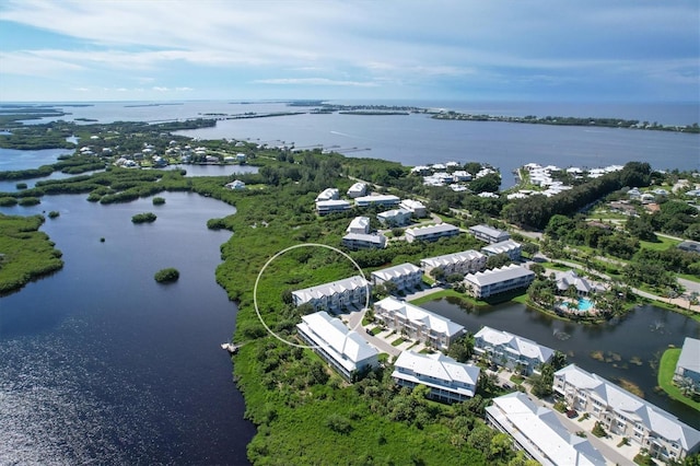 birds eye view of property featuring a water view