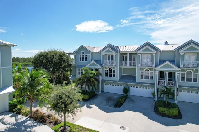 view of front of house with a garage and a balcony