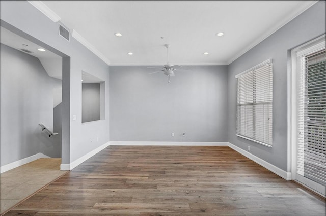 unfurnished room featuring ornamental molding, hardwood / wood-style floors, and ceiling fan