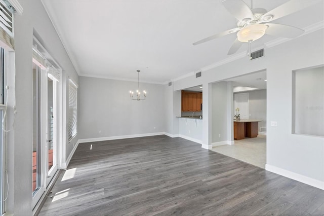 unfurnished living room featuring ceiling fan with notable chandelier, ornamental molding, and dark hardwood / wood-style floors