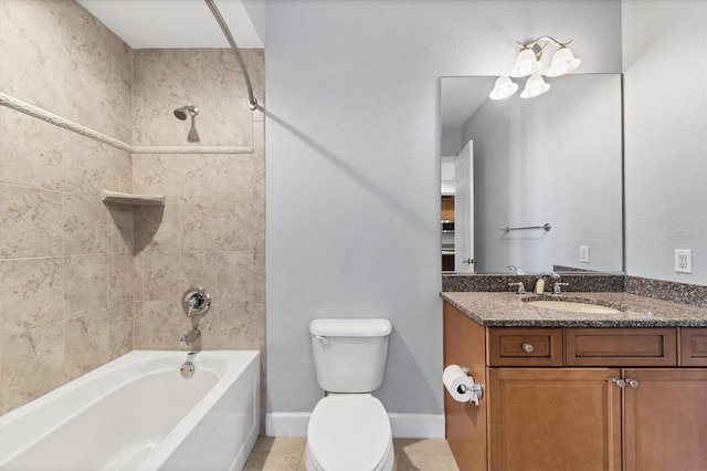 full bathroom with tile patterned floors, vanity, toilet, and tiled shower / bath combo