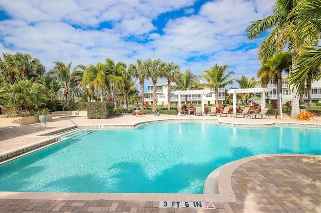 view of pool with a pergola and a patio area