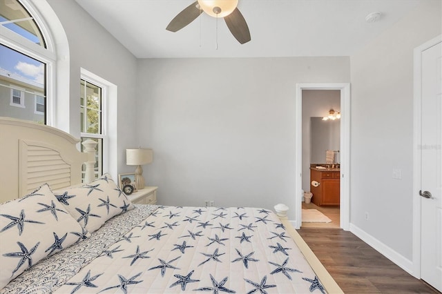 10360 Longshore Rd Unit 66, Placida, FL 33946 - bedroom with dark wood-style floors, ensuite bath, and ceiling fan