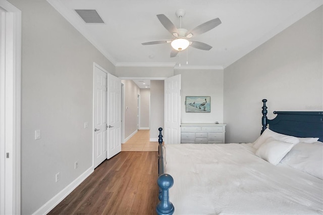 10360 Longshore Rd Unit 66, Placida, FL 33946 - bedroom with wood finished floors, ornamental molding, and ceiling fan