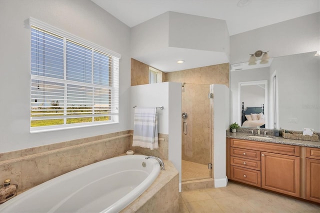 10360 Longshore Rd Unit 66, Placida, FL 33946 - bathroom featuring a bath, vanity, a shower stall, tile patterned floors, and ensuite bath