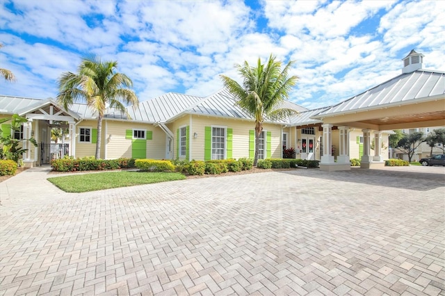 10360 Longshore Rd Unit 66, Placida, FL 33946 - view of front of home with a standing seam roof, a metal roof, and decorative driveway