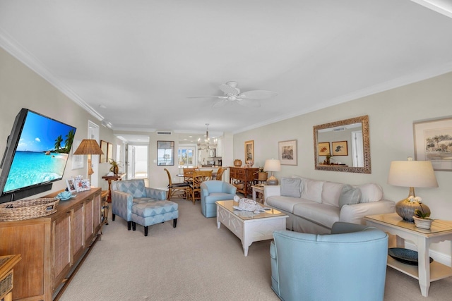 carpeted living room with ceiling fan with notable chandelier and ornamental molding