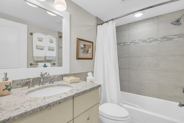 full bathroom featuring toilet, vanity, and shower / bath combo