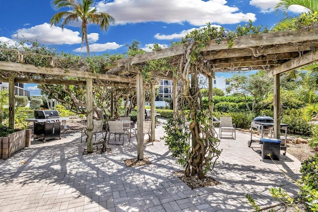 view of patio / terrace featuring a pergola and a grill