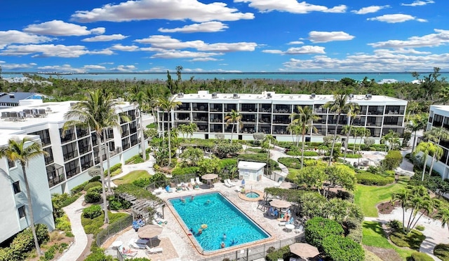 birds eye view of property with a water view