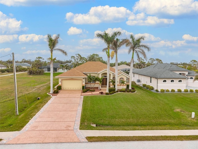 view of front of house with a garage and a front lawn