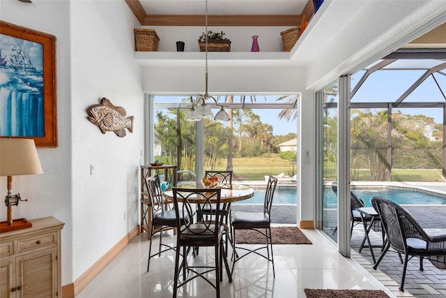 tiled dining area with a high ceiling