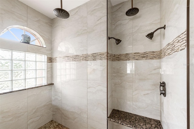 bathroom with tiled shower