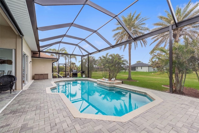 view of pool featuring a patio area, a lanai, and a lawn