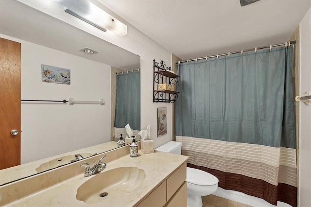 bathroom featuring vanity, curtained shower, and toilet