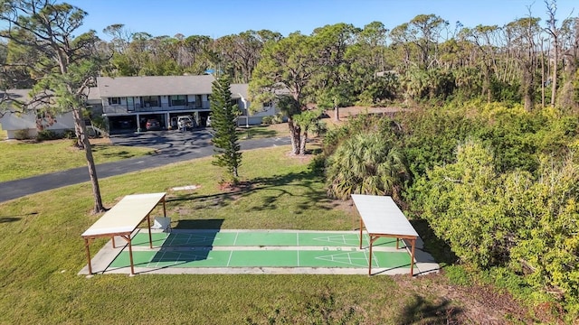 view of property's community with a yard