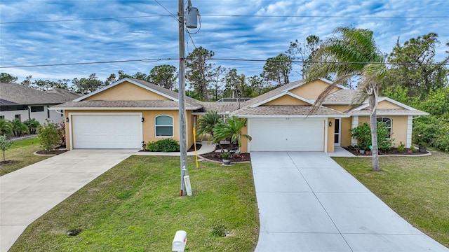 single story home with a front yard and a garage