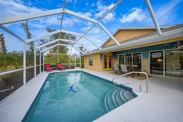 view of swimming pool with a lanai and a patio