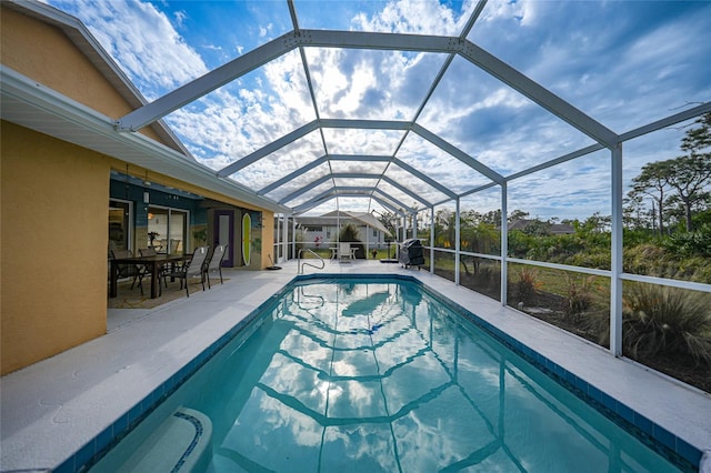 view of pool featuring a lanai and a patio area