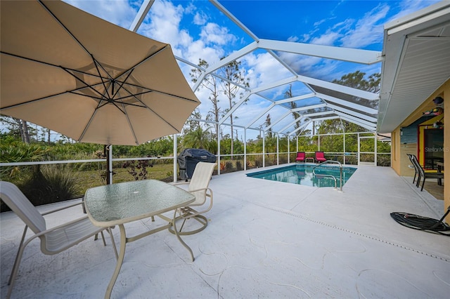 view of pool featuring a patio area and a lanai