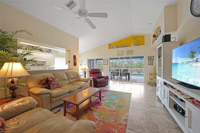 living room with light tile patterned flooring, high vaulted ceiling, and ceiling fan