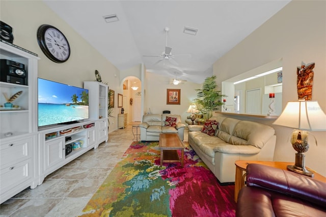 living room with ceiling fan and vaulted ceiling