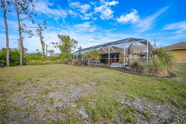 view of yard with glass enclosure