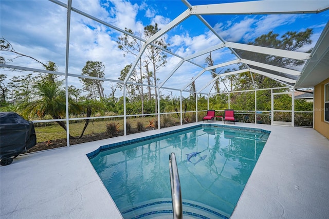 view of pool featuring area for grilling, glass enclosure, and a patio area