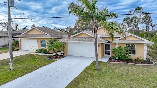 view of front of home featuring a front yard and a garage