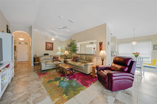 tiled living room with vaulted ceiling