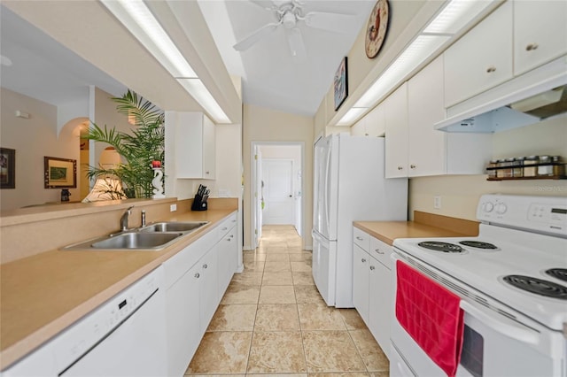 kitchen with white cabinetry, lofted ceiling, sink, white appliances, and ceiling fan