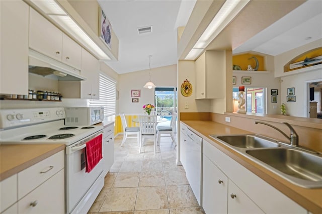 kitchen featuring sink, white appliances, white cabinets, and hanging light fixtures