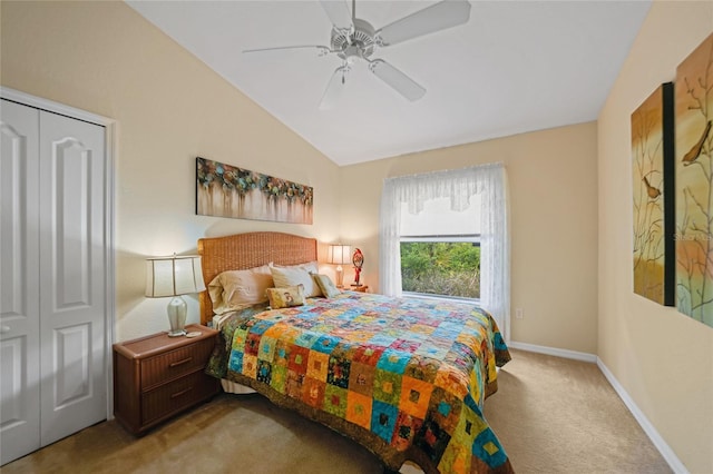 bedroom with lofted ceiling, ceiling fan, and light colored carpet