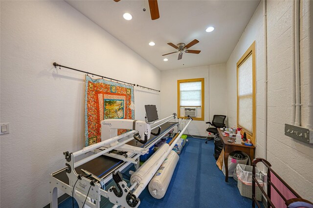 workout area featuring cooling unit and ceiling fan