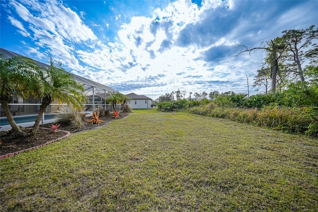 view of yard with a lanai