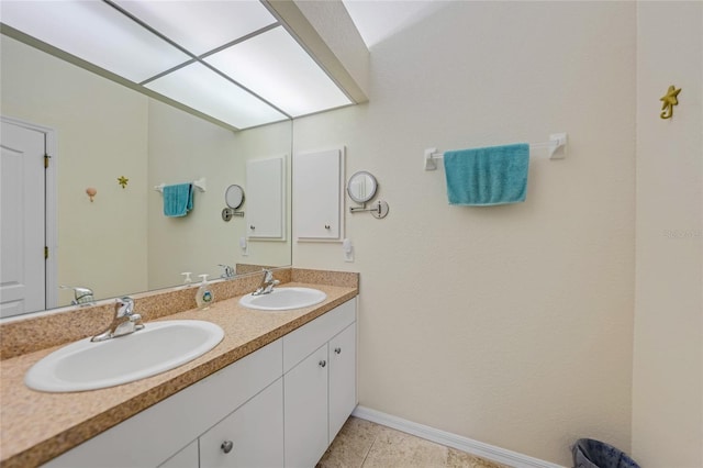 215 Australian Dr, Rotonda West, FL 33947 - bathroom featuring baseboards and double vanity