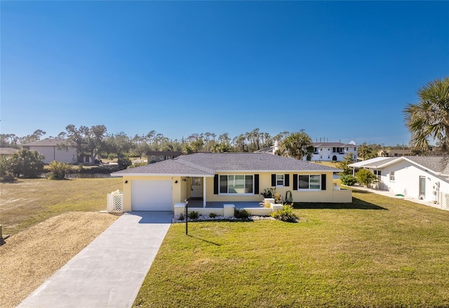 ranch-style house with a garage and a front yard