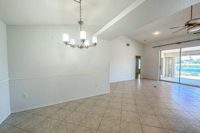 empty room with light tile patterned flooring, lofted ceiling, and ceiling fan with notable chandelier