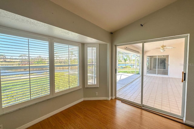 interior space featuring vaulted ceiling and ceiling fan