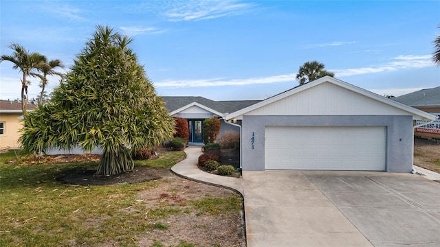 ranch-style home with a garage and a front lawn